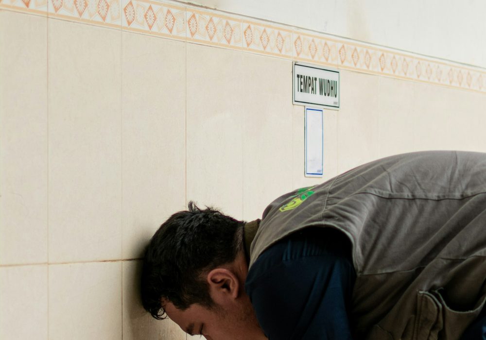 Worker using a power tool to fasten interior wall points